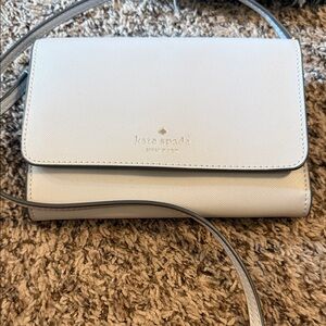 kate spade cream crossbody bag with gold logo